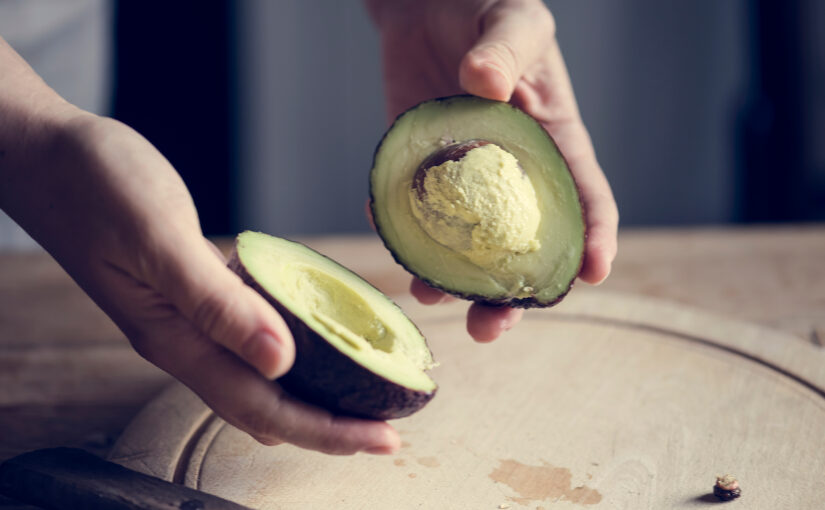 A fresh avocado cut in half
