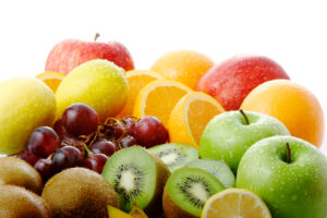 assorted fruit including apples, orange slices and grapes