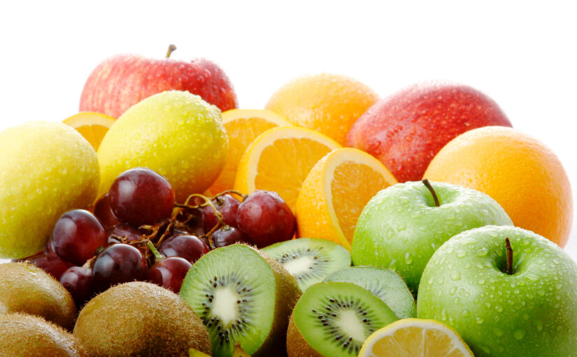 assorted fruit including apples, orange slices and grapes