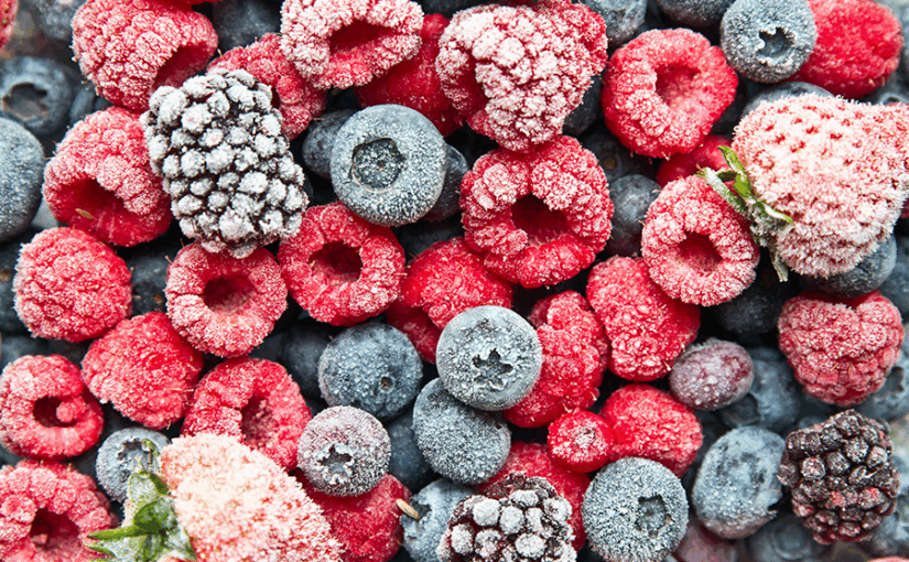 A closeup of frozen raspberries, blackberries and blueberries