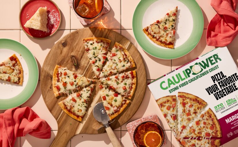 A freshly sliced cauliflower-crust pizza