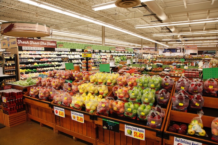 Brightly colored produce displayed in a grocery store.
