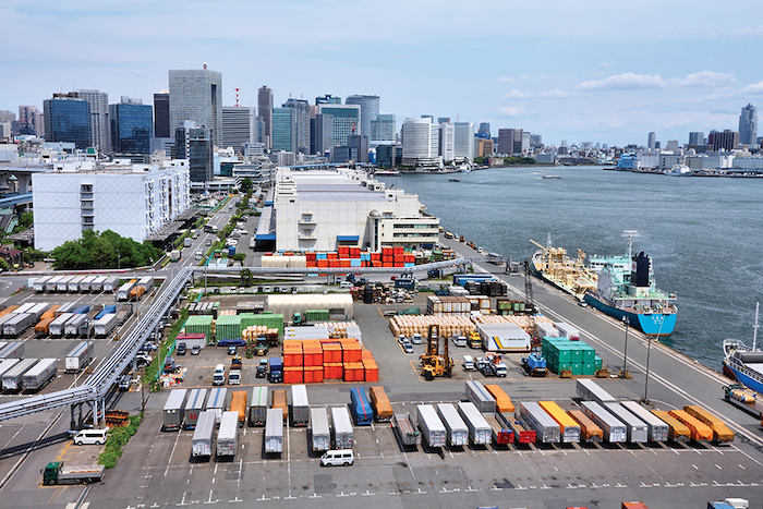 A busy seaport with various modes of transport