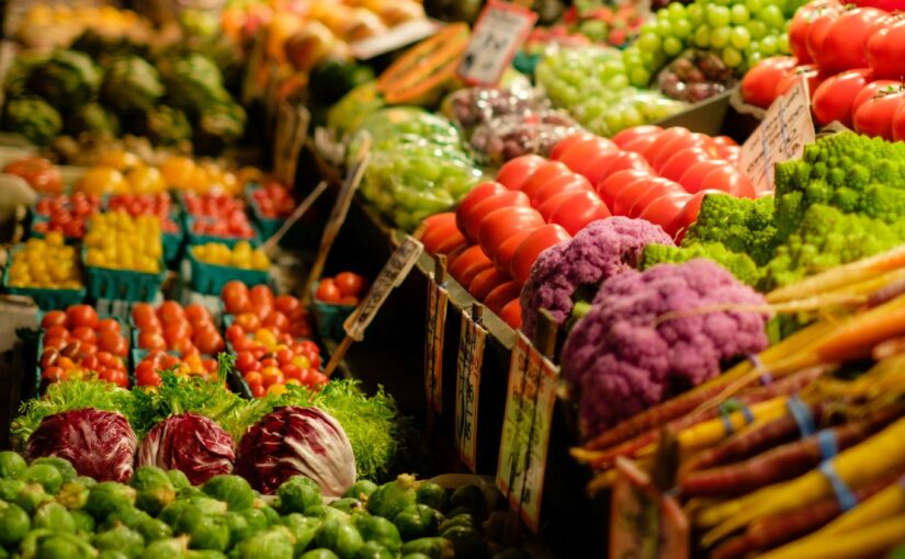 A brightly colored selection of fruits and vegetables in a market