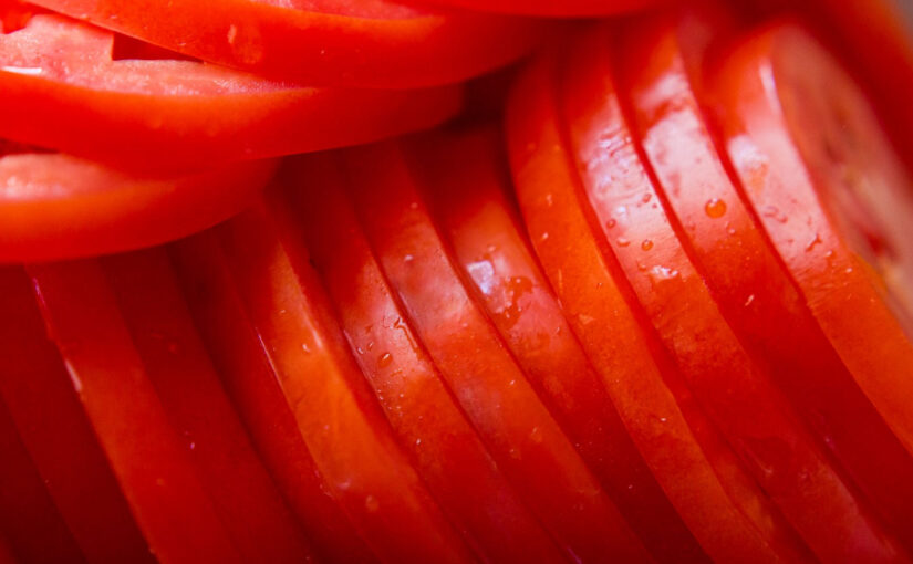 close up of ripe, red tomtate slices