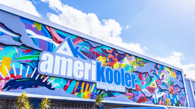 A brightly colored sign with Amerikooler logo