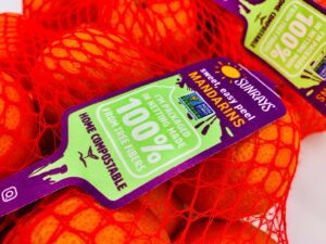 Bright orange mandarins in sustainable packaging